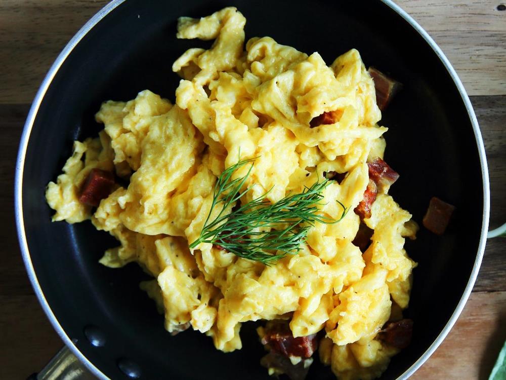 A pan containing Egg scramble with cream and cheese